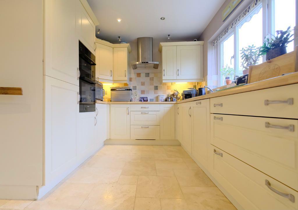 Kitchen with fitted appliances
