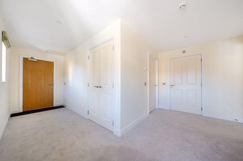 Hallway with storage cupboards