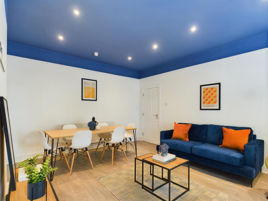 A spacious and stylish living room perfect for ...