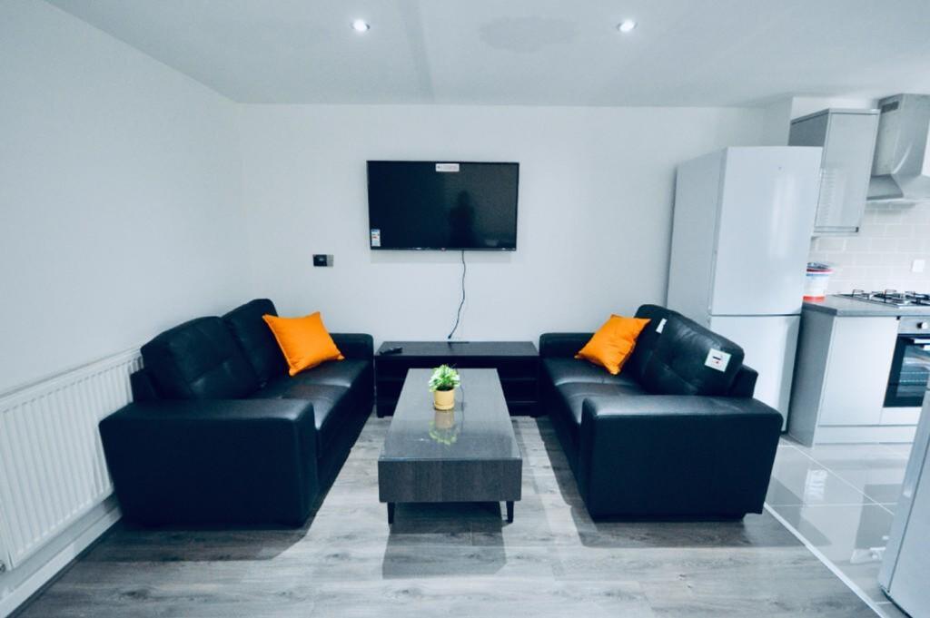 A spacious and inviting modern living room with...