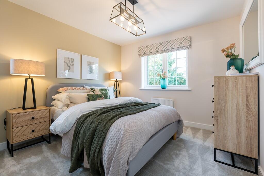 Bedroom one is spacious and tranquil