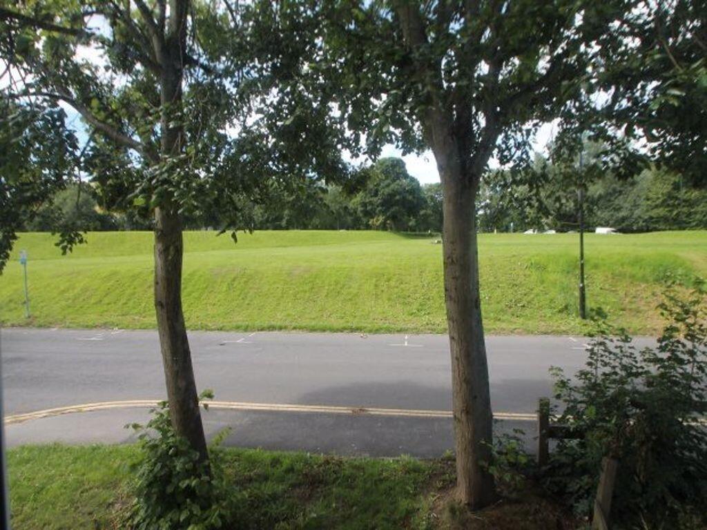 A peaceful garden area featuring a well-maintai...