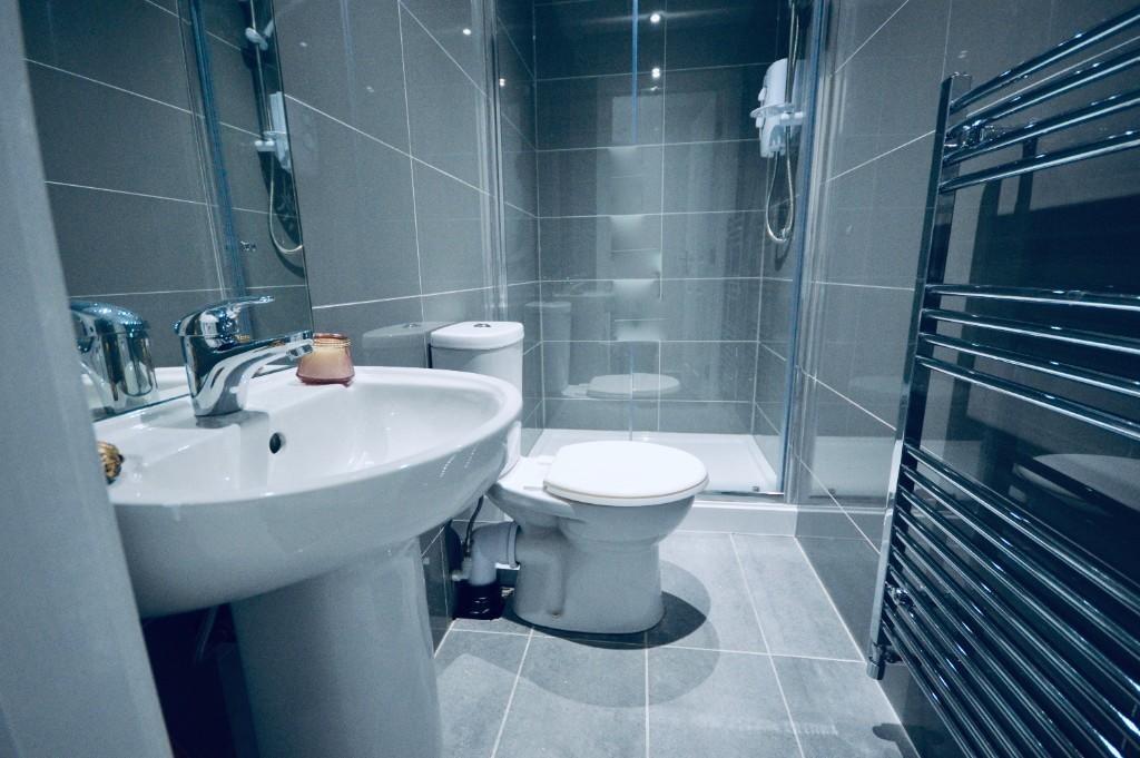 Modern bathroom featuring sleek fixtures and am...