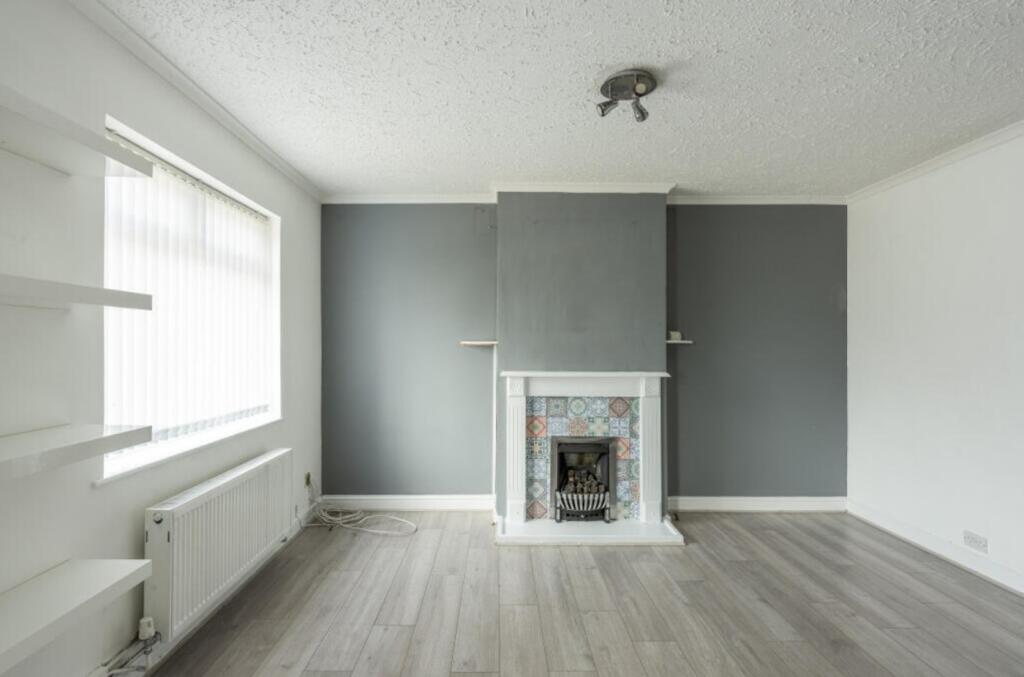 A spacious living room featuring a charming fir...