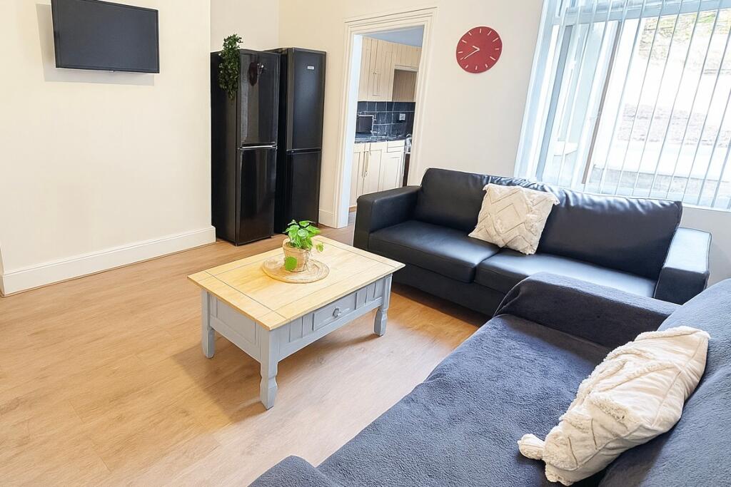 Bright and welcoming living room featuring two ...