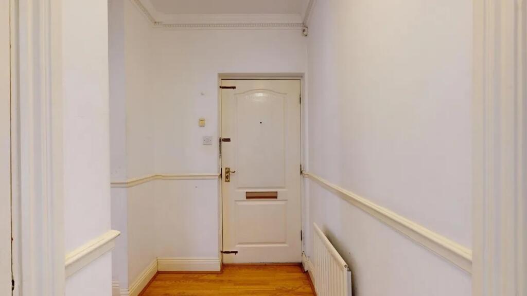 Bright and clean hallway with fresh white walls...