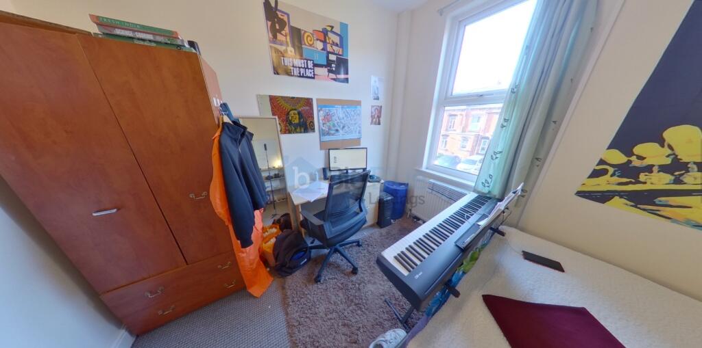 Bright and cozy single bedroom featuring a larg...