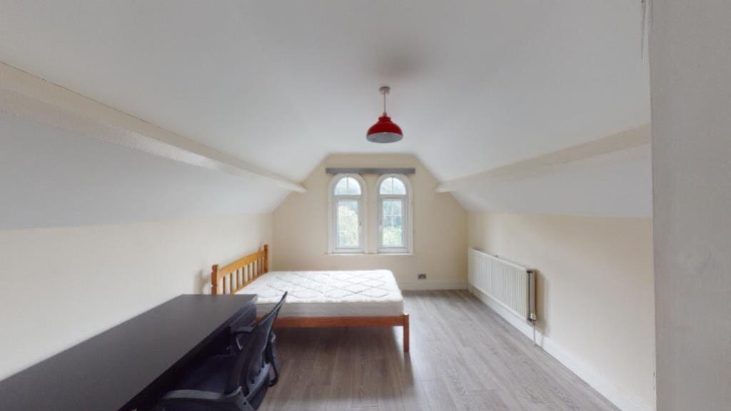 Bright and spacious attic master bedroom featur...