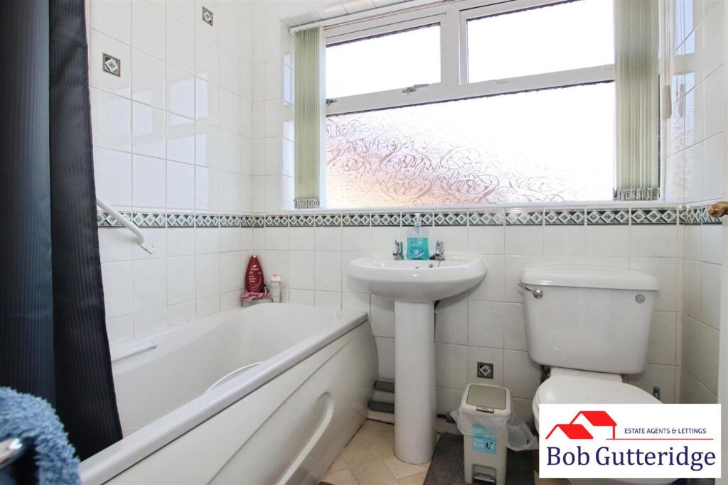 FULLY TILED BATHROOM