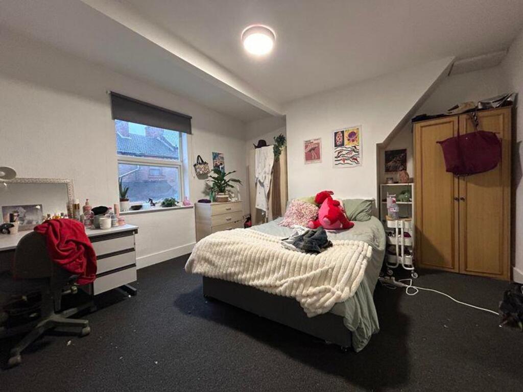 A spacious and inviting double bedroom, perfect...