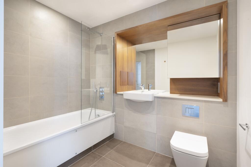 Experience the elegance of modern bathroom design with sleek fixtures and stylish accents.