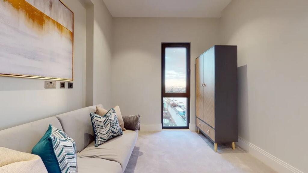 A stylish and modern living room featuring a co...
