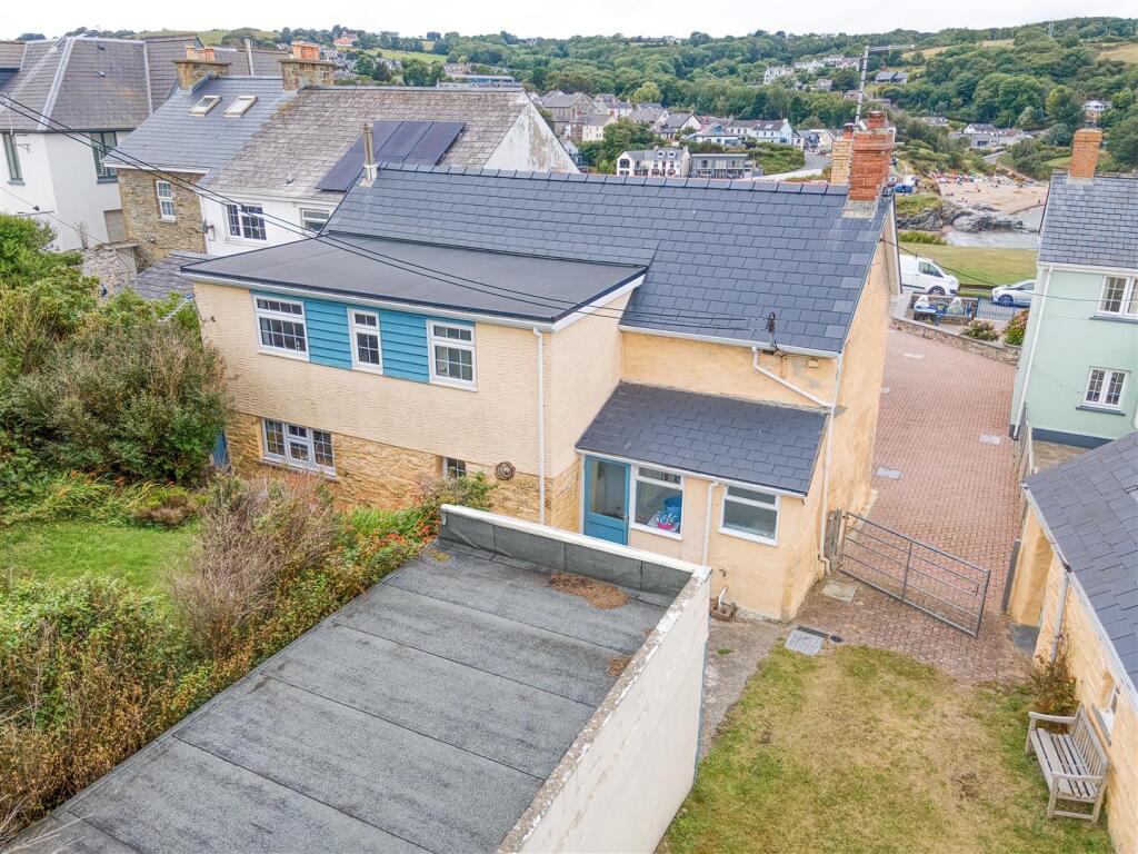 Aerial view of house and beach