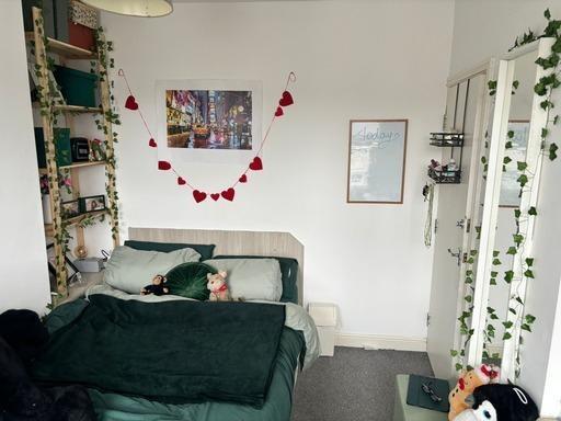 A cozy, well-maintained living room featuring a...