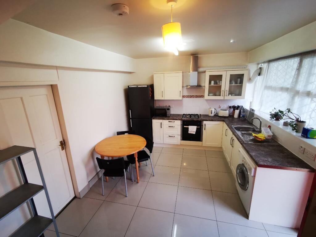 Bright and functional kitchen with ample counte...