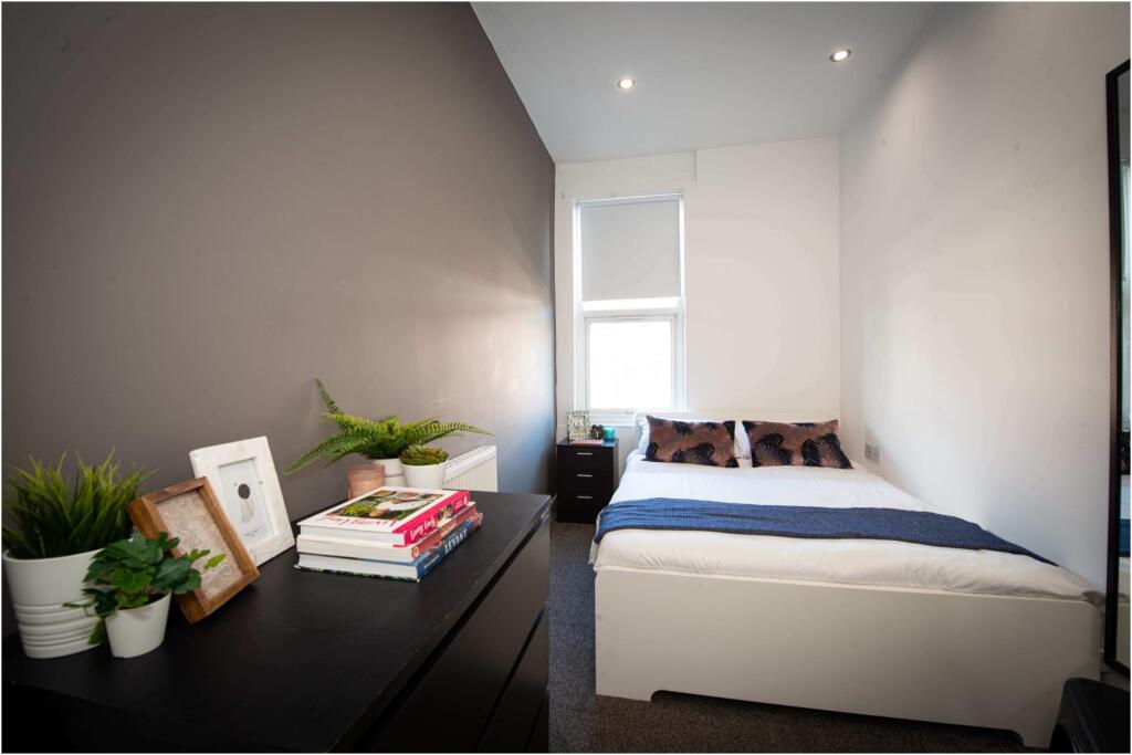 Bright and neatly maintained master bedroom fea...