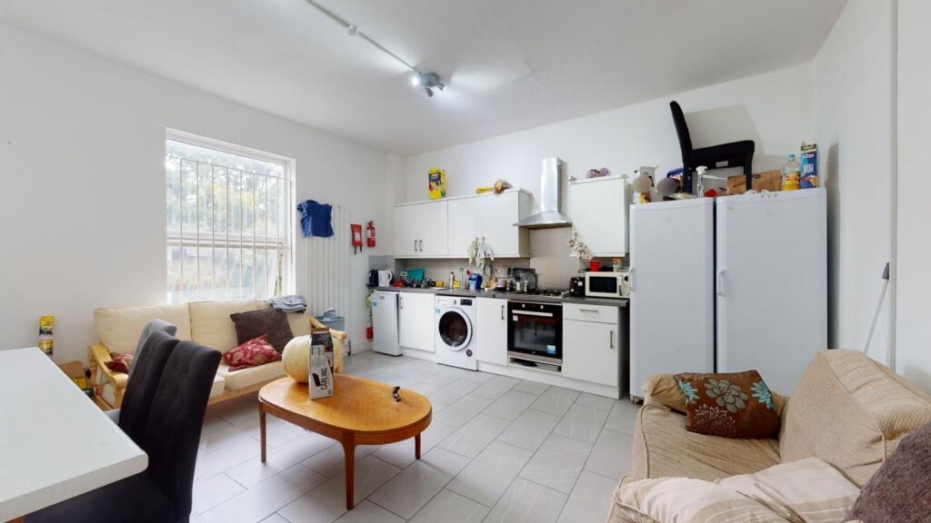 Bright and welcoming kitchen space featuring mo...