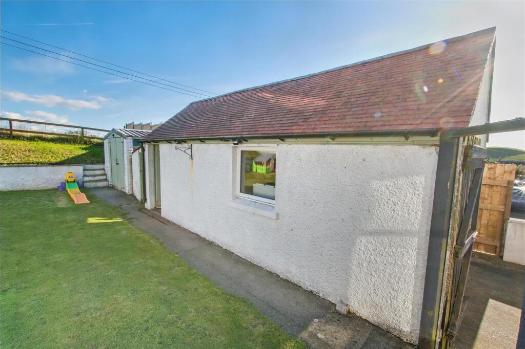 Detached garage and store sheds
