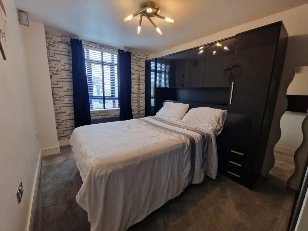 main bedroom with lights on