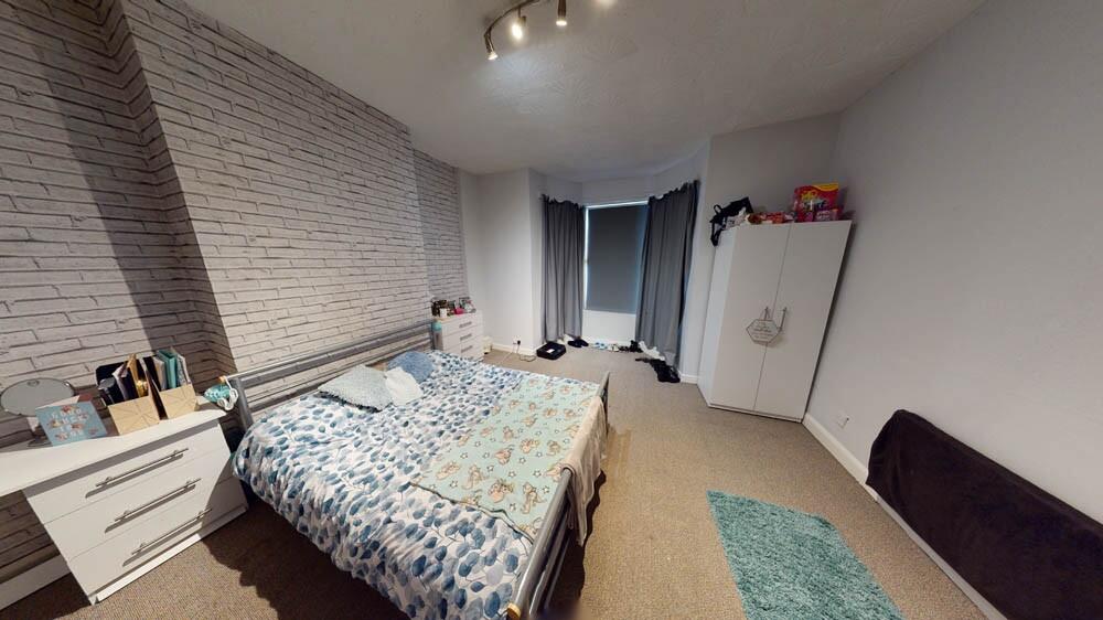 Bright, modern double bedroom with contemporary...