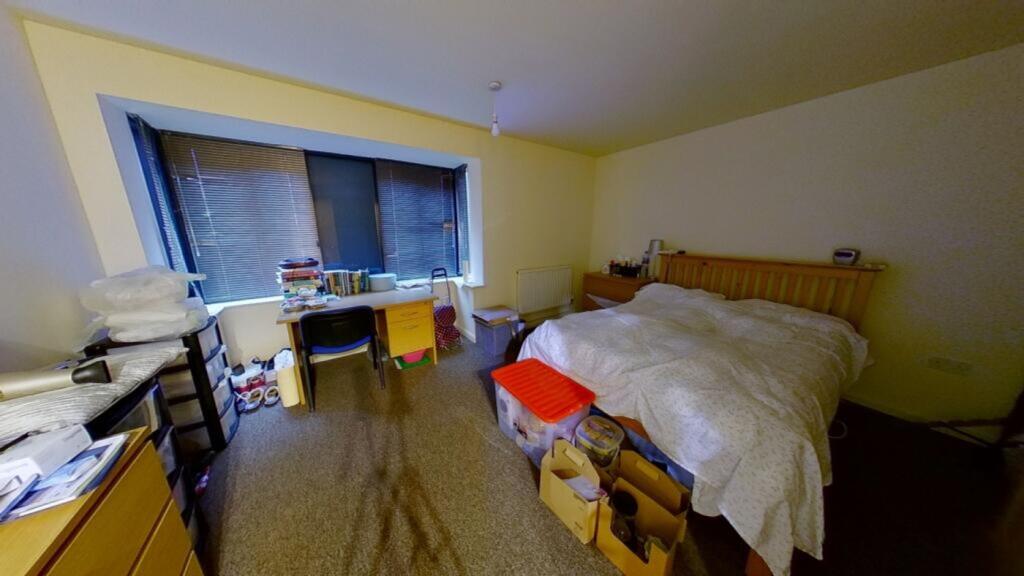 A spacious and well-lit large double bedroom wi...
