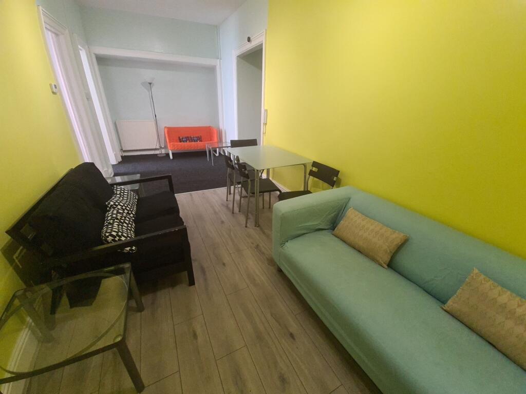 A bright and welcoming living room featuring a ...