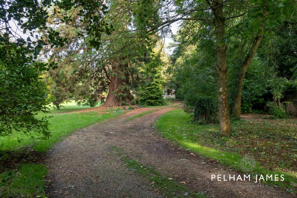 Gated gravel driveway to Greetham House, Greetham, Rutland