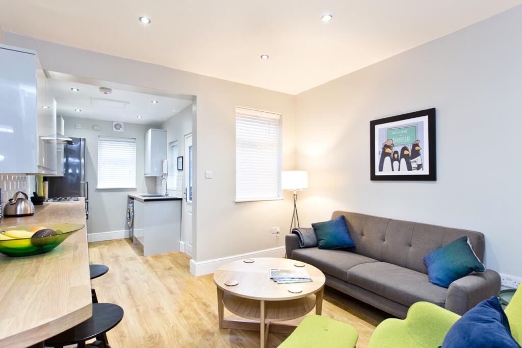 A modern, brightly lit living room featuring a ...