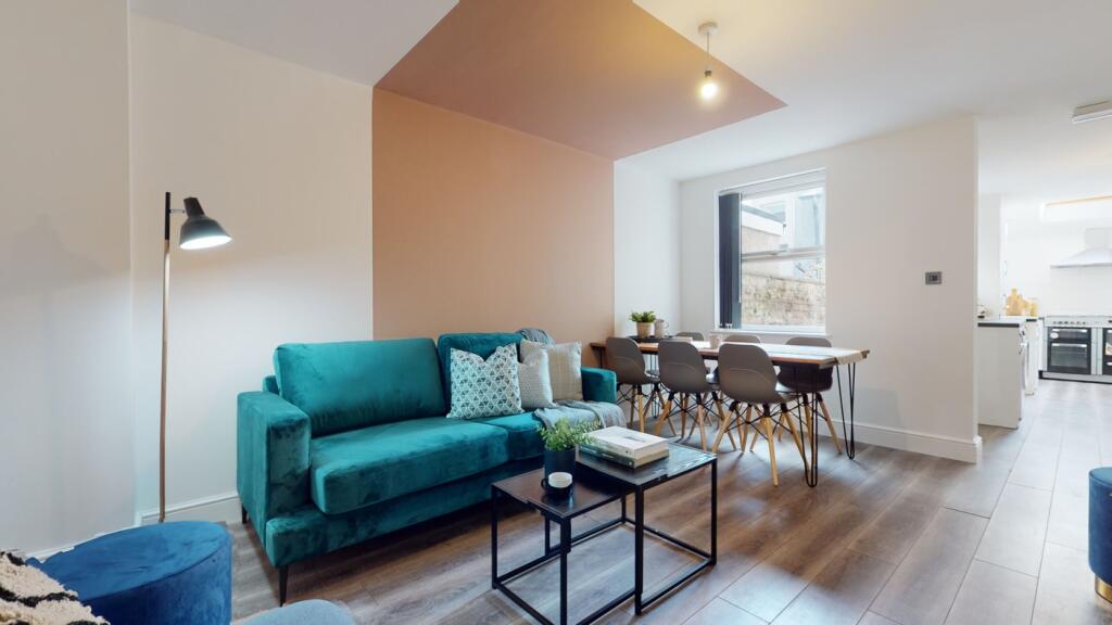 A spacious and stylish modern living room perfe...