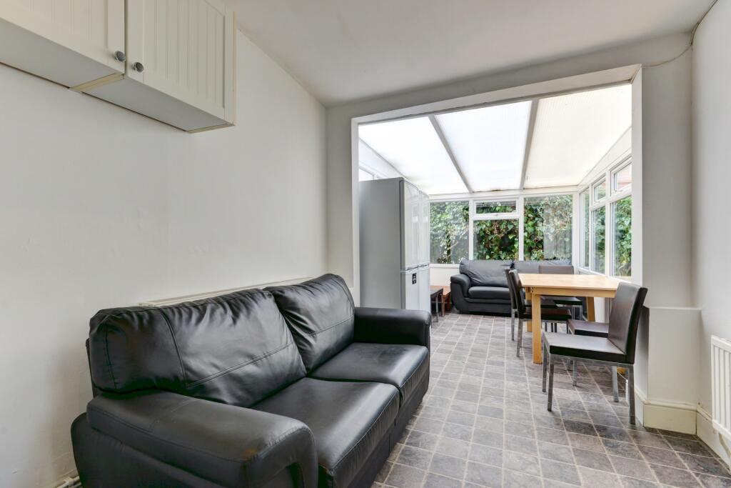 Bright and welcoming living room featuring a co...