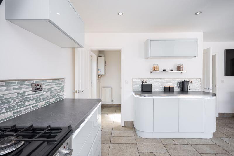 Kitchen through to Utility