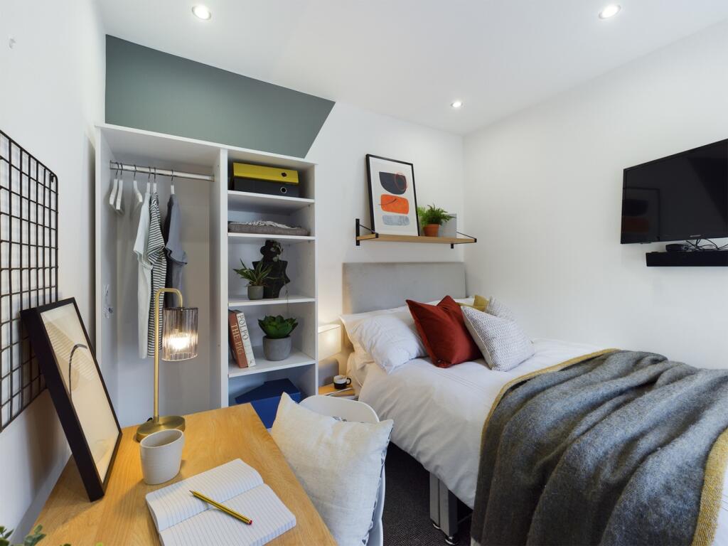 A stylish and inviting double bedroom featuring...