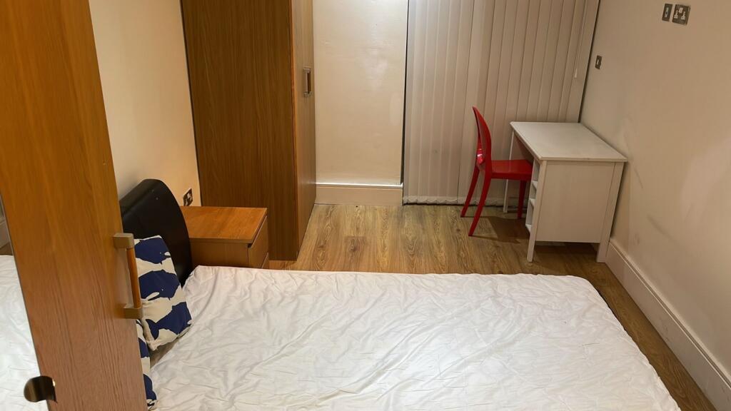 Bright and inviting double bedroom featuring a ...