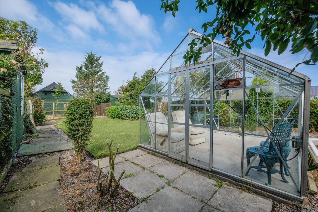 Rear garden and greenhouse