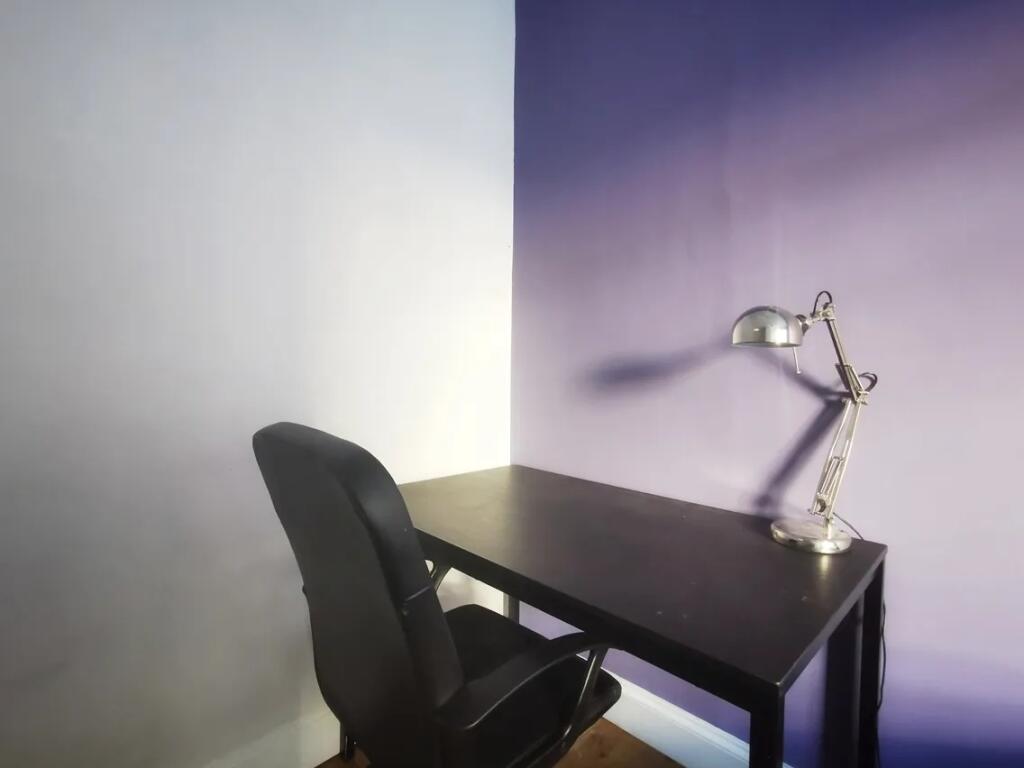 A neat and modern workspace featuring a sleek b...