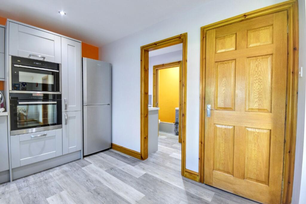 Kitchen through to Utility Room