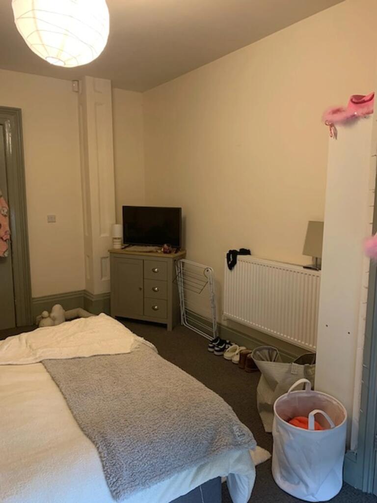 A cozy double bedroom featuring a comfortable a...