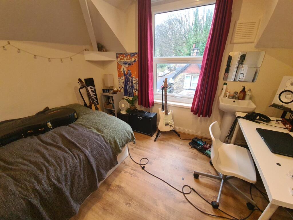 Cozy bedroom featuring a comfortable bed, a spa...