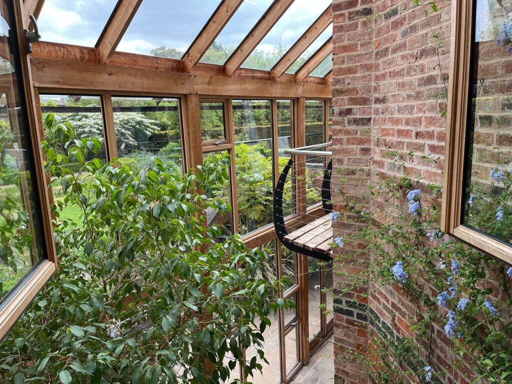 The open plan living space has wonderful views through the garden room