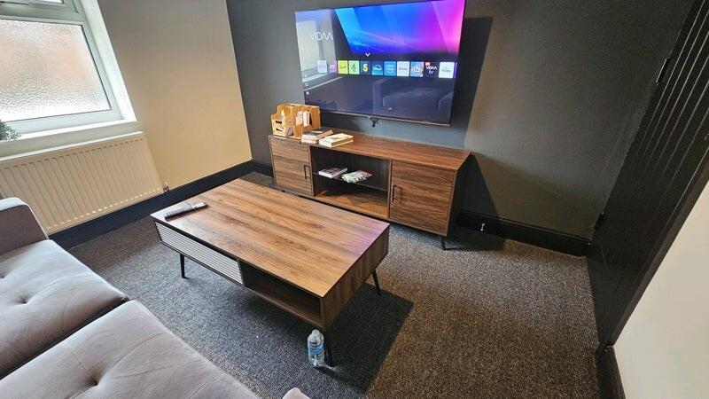 Modern and comfortable living room featuring a ...