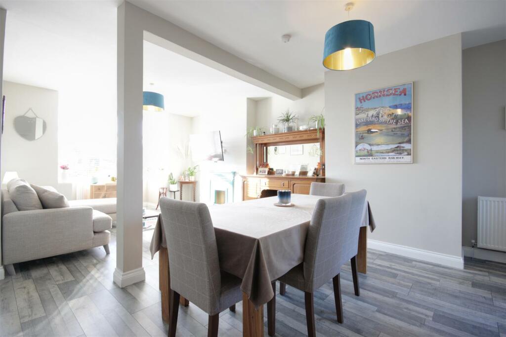 THROUGH LOUNGE AND DINING ROOM