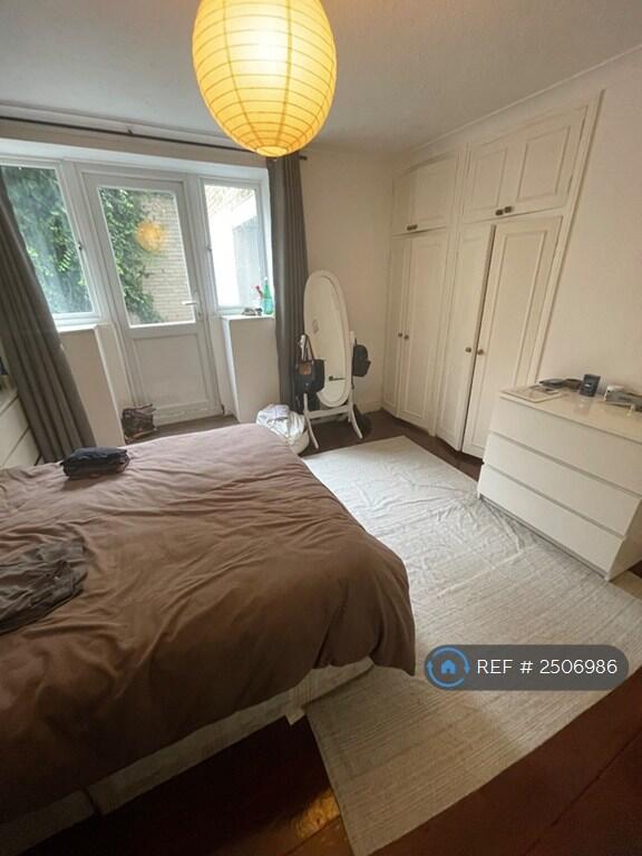 Bedroom/Door Leading To Garden