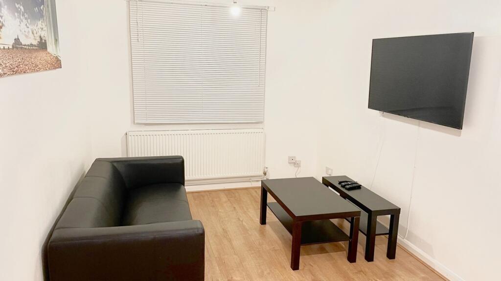 This contemporary living room features a sleek ...