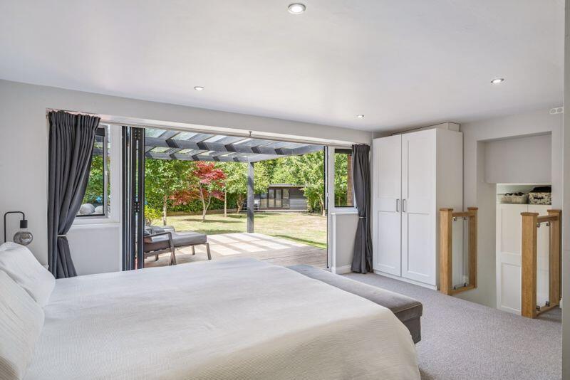 Main bedroom and doors to garden