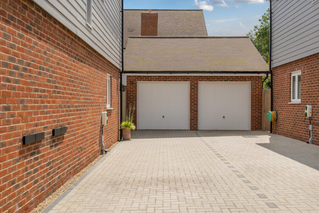 Driveway providing parking for two / three vehicles and garage with power and light