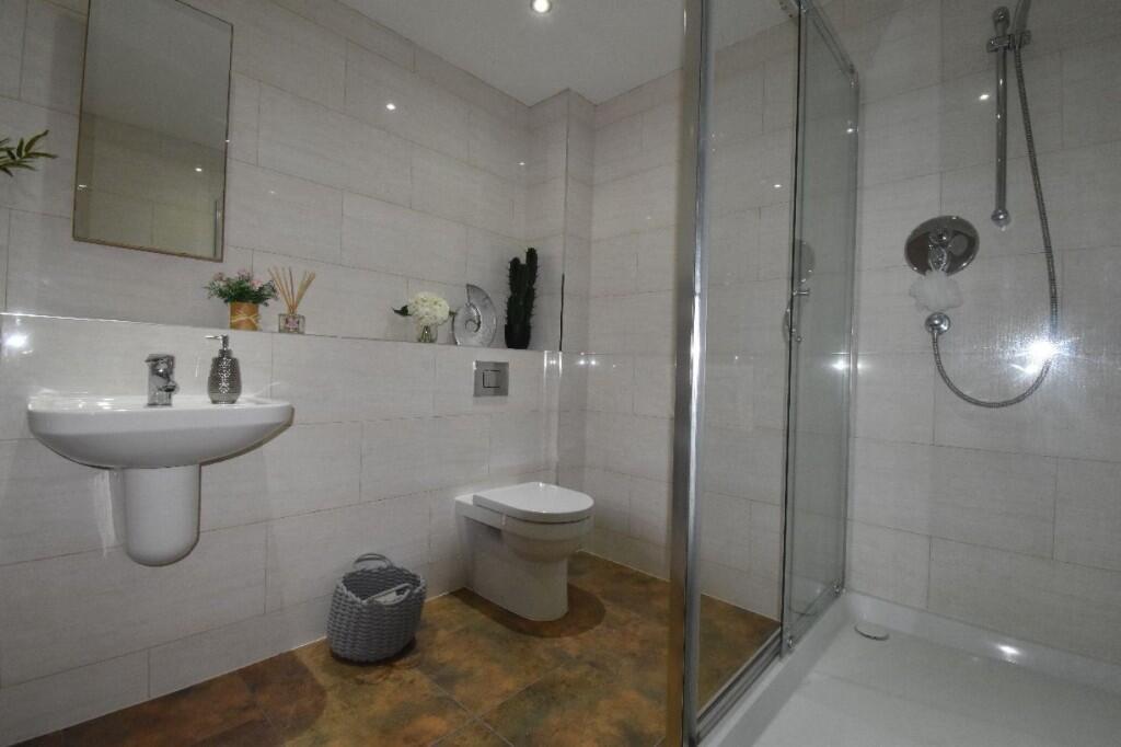 A modern and well-maintained bathroom featuring...