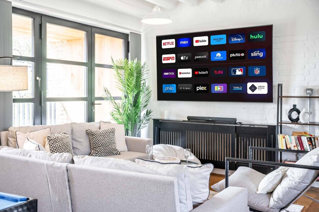 A stylish and contemporary living room featurin...