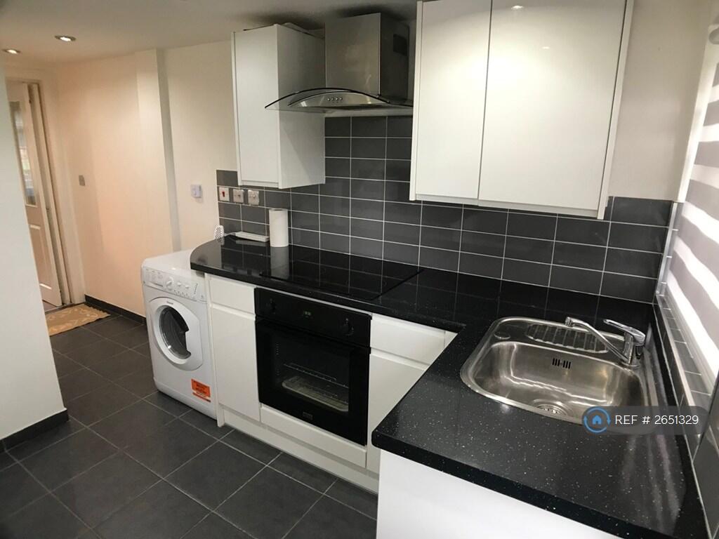 Kitchen With a Door To Bedroom / Living Area 