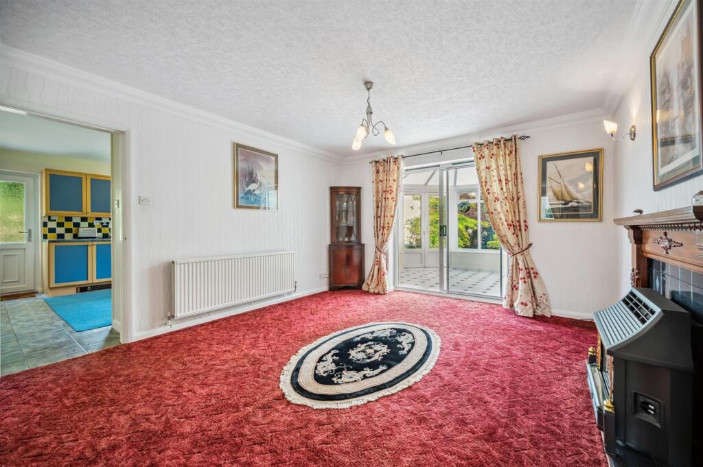 Sitting Room towards Kitchen and Conservatory.jpg