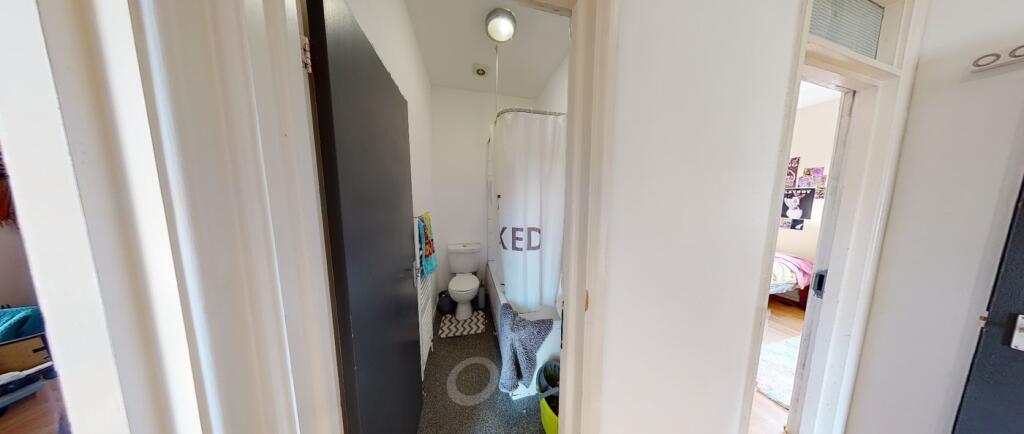 A tidy bathroom featuring a shower, ideal for s...